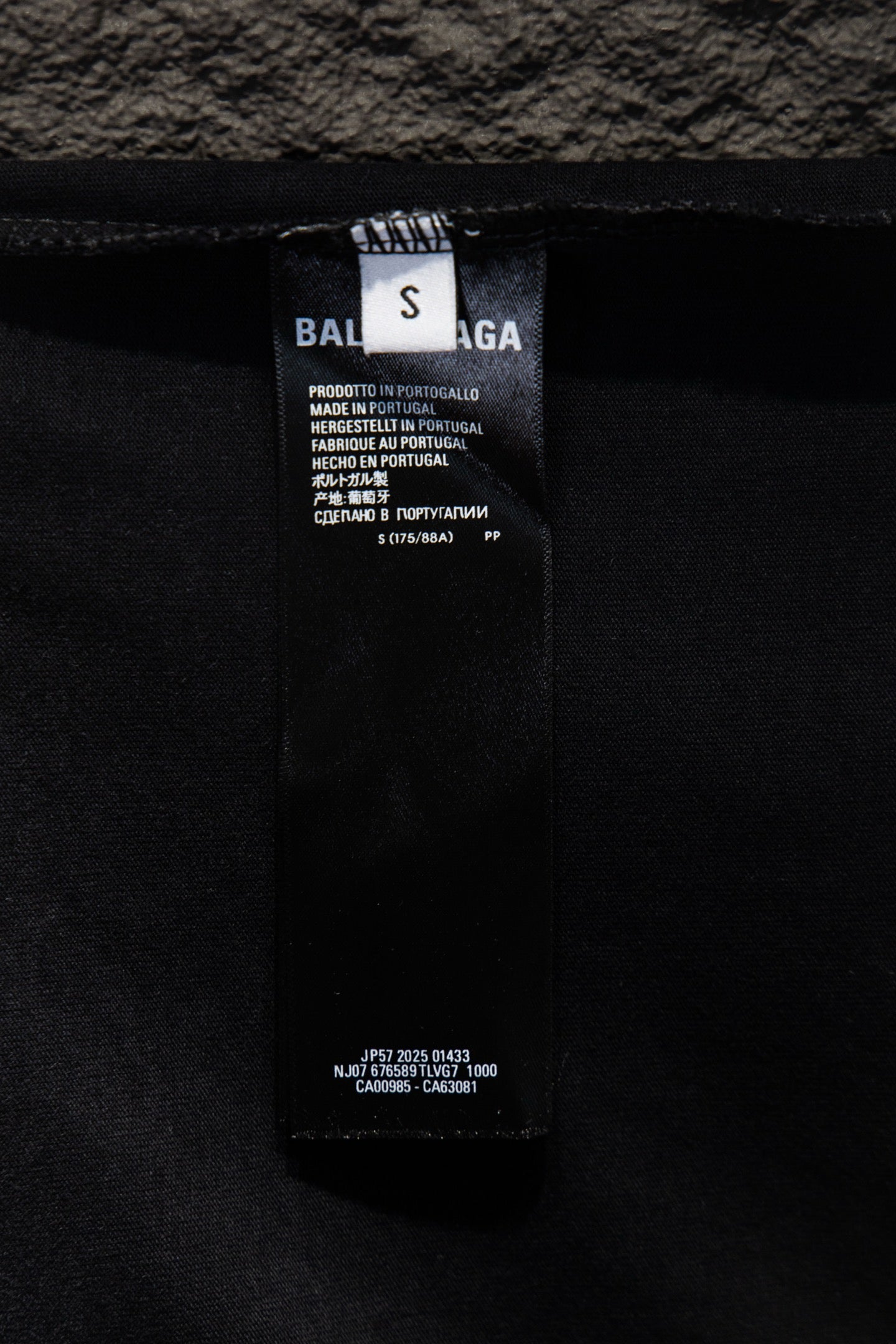 Balenciaga inside label and care tag on dark gray T-shirt