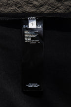 Balenciaga interior neck tag on dark T-shirt with care information
