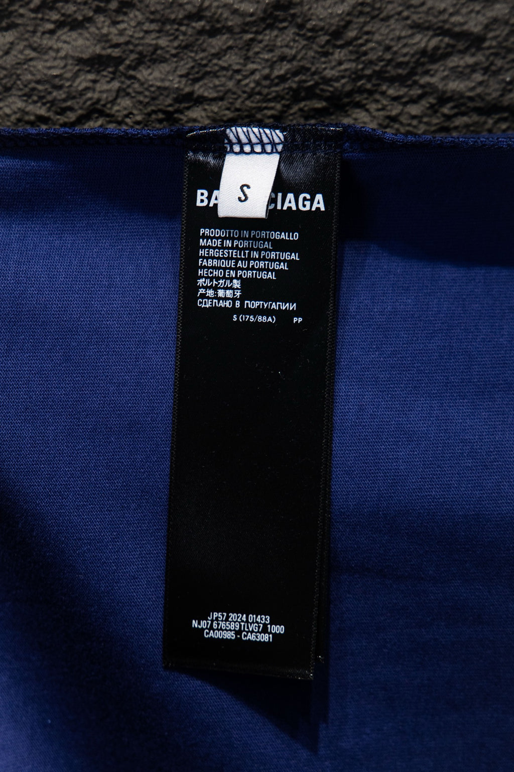 Balenciaga blue clothing label at waistband with care and product details