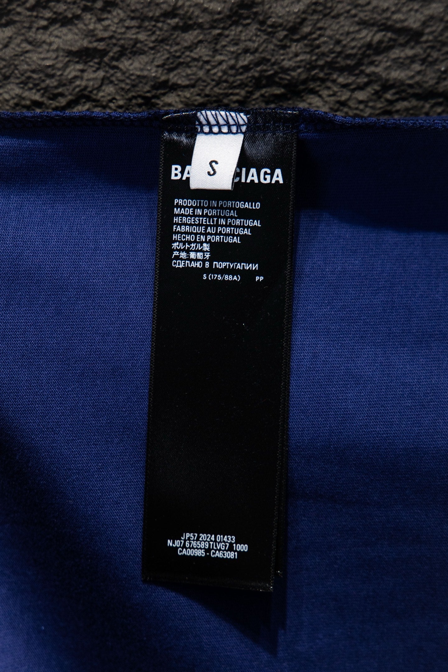 Balenciaga blue clothing label at waistband with care and product details