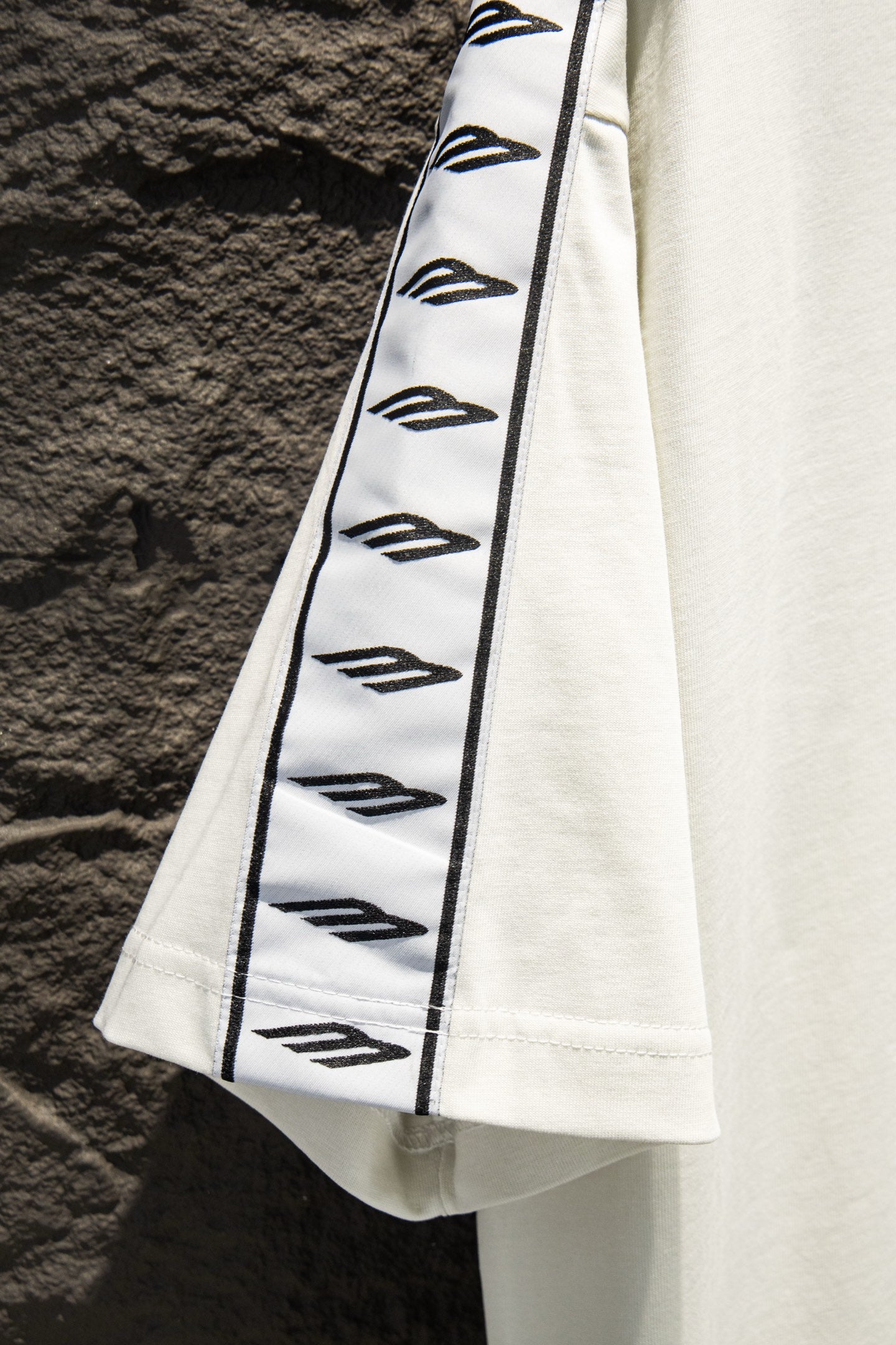Balenciaga T-shirt sleeve panel, white with black stripe and graphic pattern