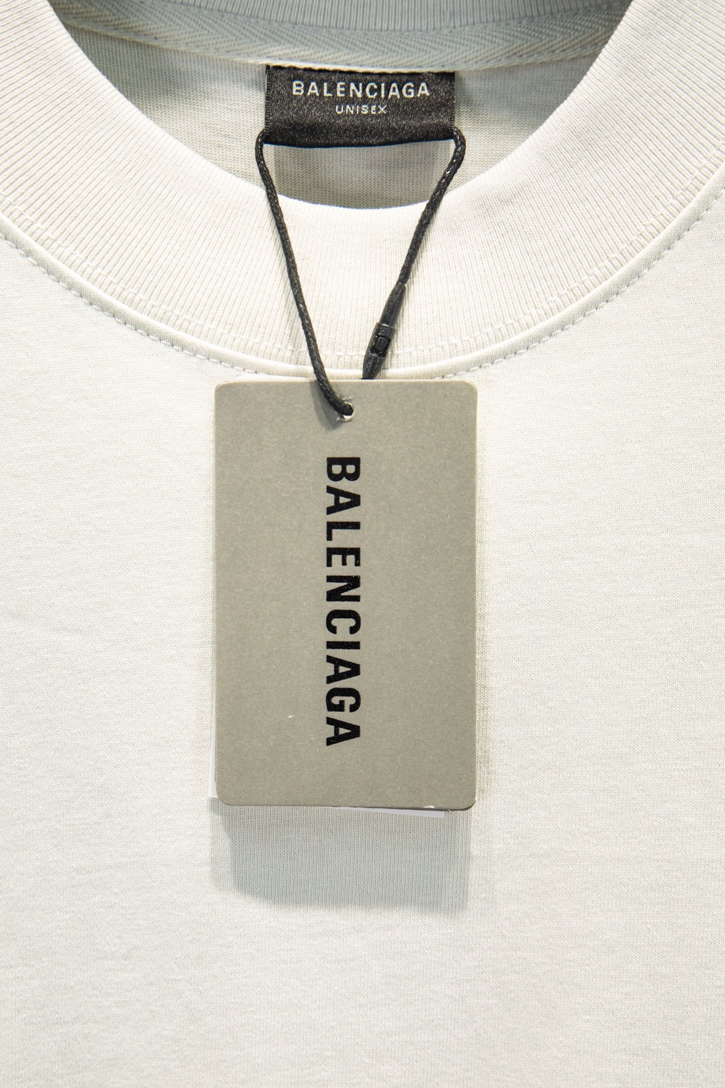 Balenciaga T-shirt neck tag, gray hang tag with brand label