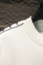 Balenciaga T-shirt sleeve trim, white fabric with black-and-blue striped band
