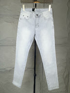 Light-wash denim jeans with belt loops, front button, and two front pockets