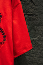 Balenciaga bright red T-shirt sleeve and side hem detail