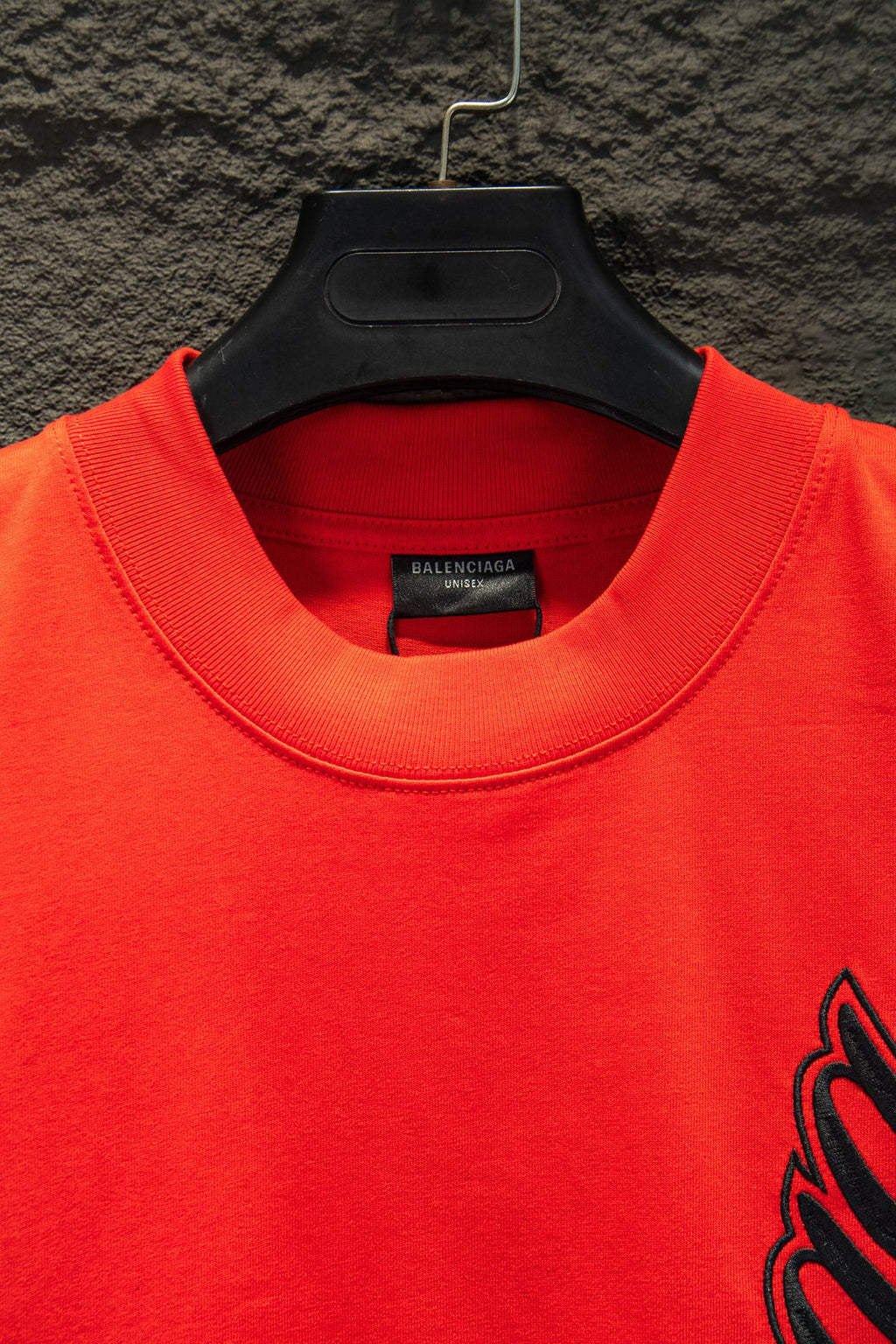 Balenciaga crew-neck T-shirt neckline close-up in bright red with inner label