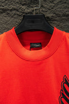 Balenciaga crew-neck T-shirt neckline close-up in bright red with inner label