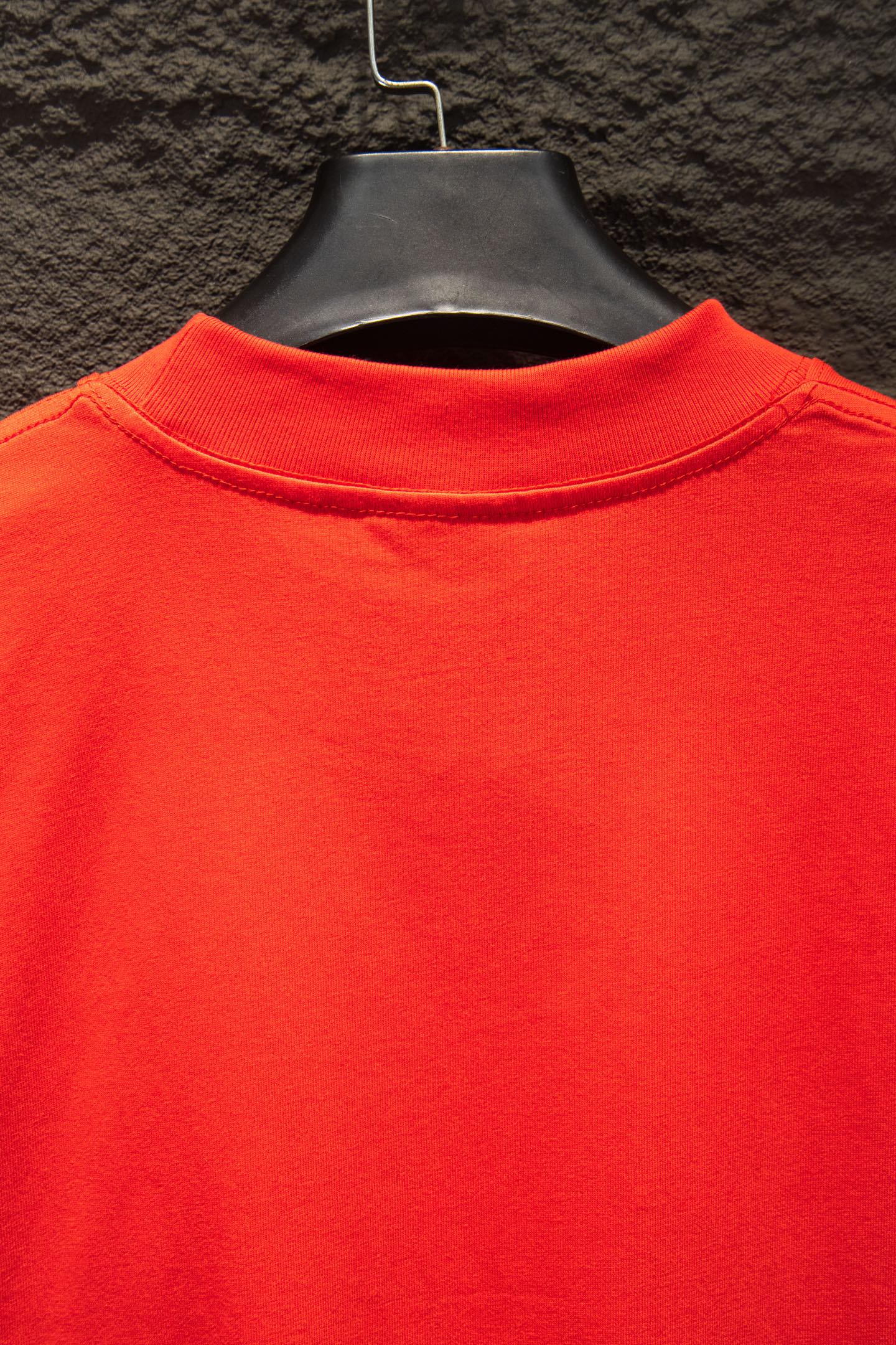 Balenciaga crew-neck T-shirt collar close-up in bright red