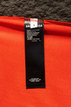 Balenciaga T-shirt care label with text on bright red fabric