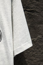 White T-shirt sleeve with neat hem, side view