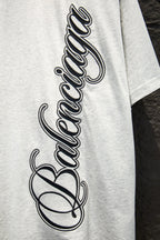 White T-shirt with large black Balenciaga script graphic on chest