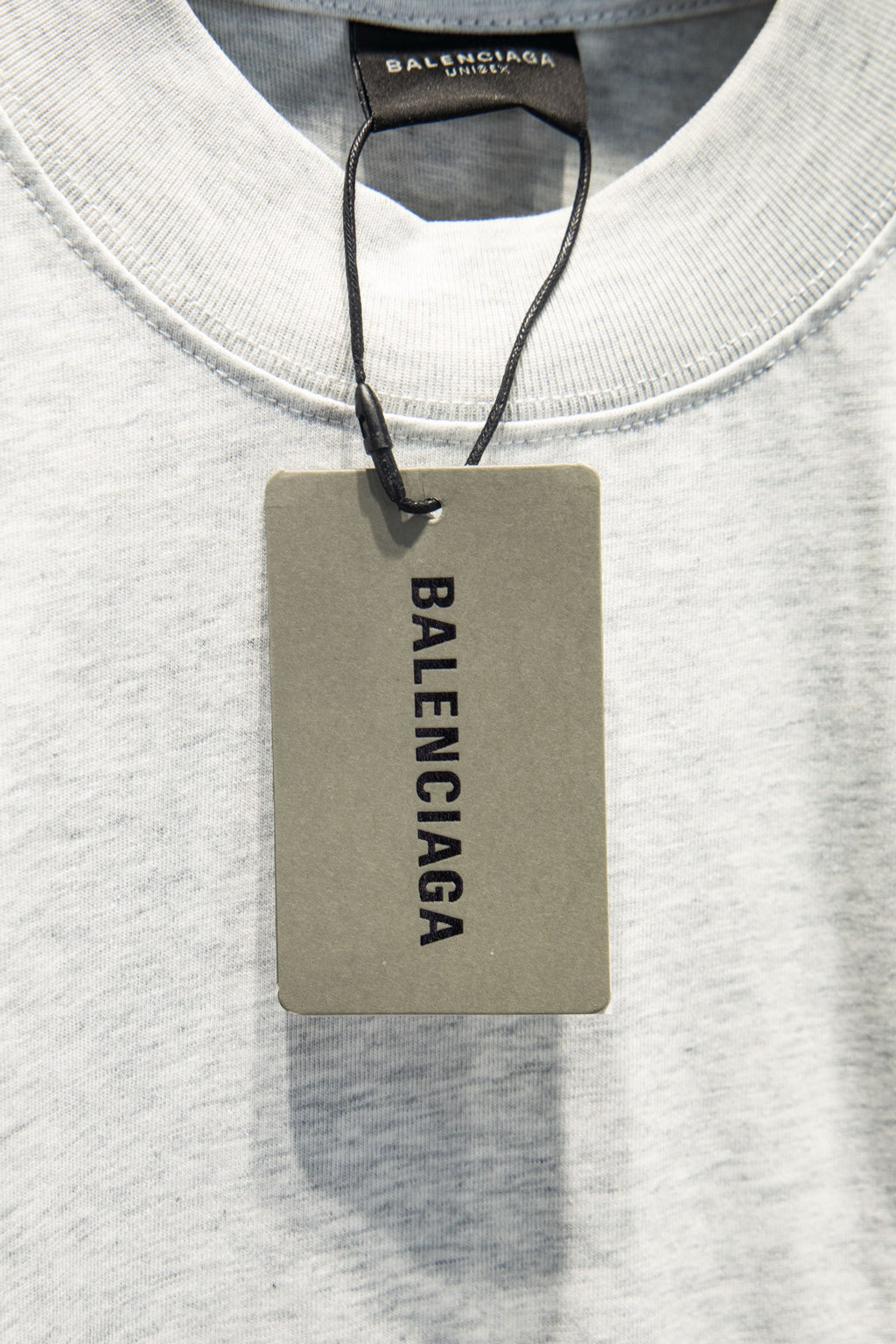 White crewneck T-shirt with Balenciaga hang tag at neckline