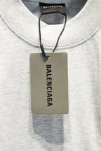 White crewneck T-shirt with Balenciaga hang tag at neckline