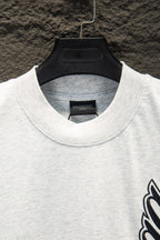 White crewneck T-shirt neckline with black Balenciaga inner label