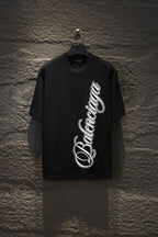 Balenciaga short-sleeve T-shirt in black with large white script logo on front