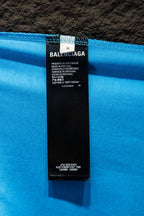 Balenciaga T-shirt care label inside collar on light blue fabric