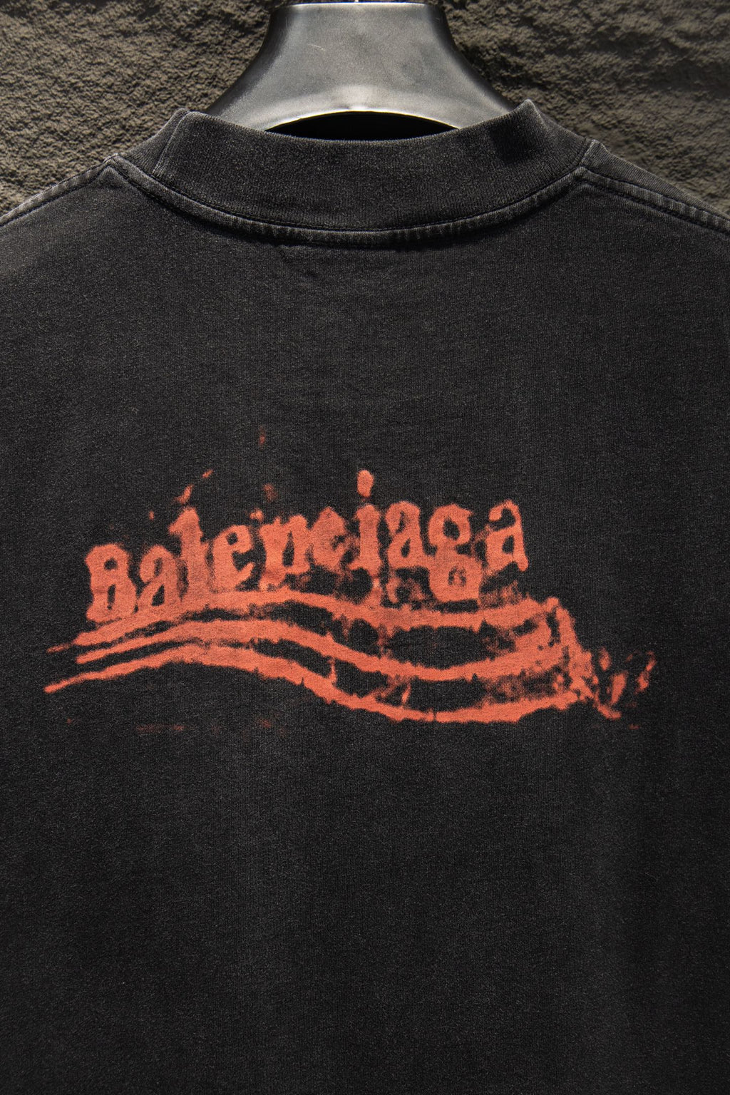 Black Balenciaga T-shirt with orange distressed logo on chest