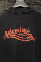 Black Balenciaga T-shirt with orange distressed logo on chest