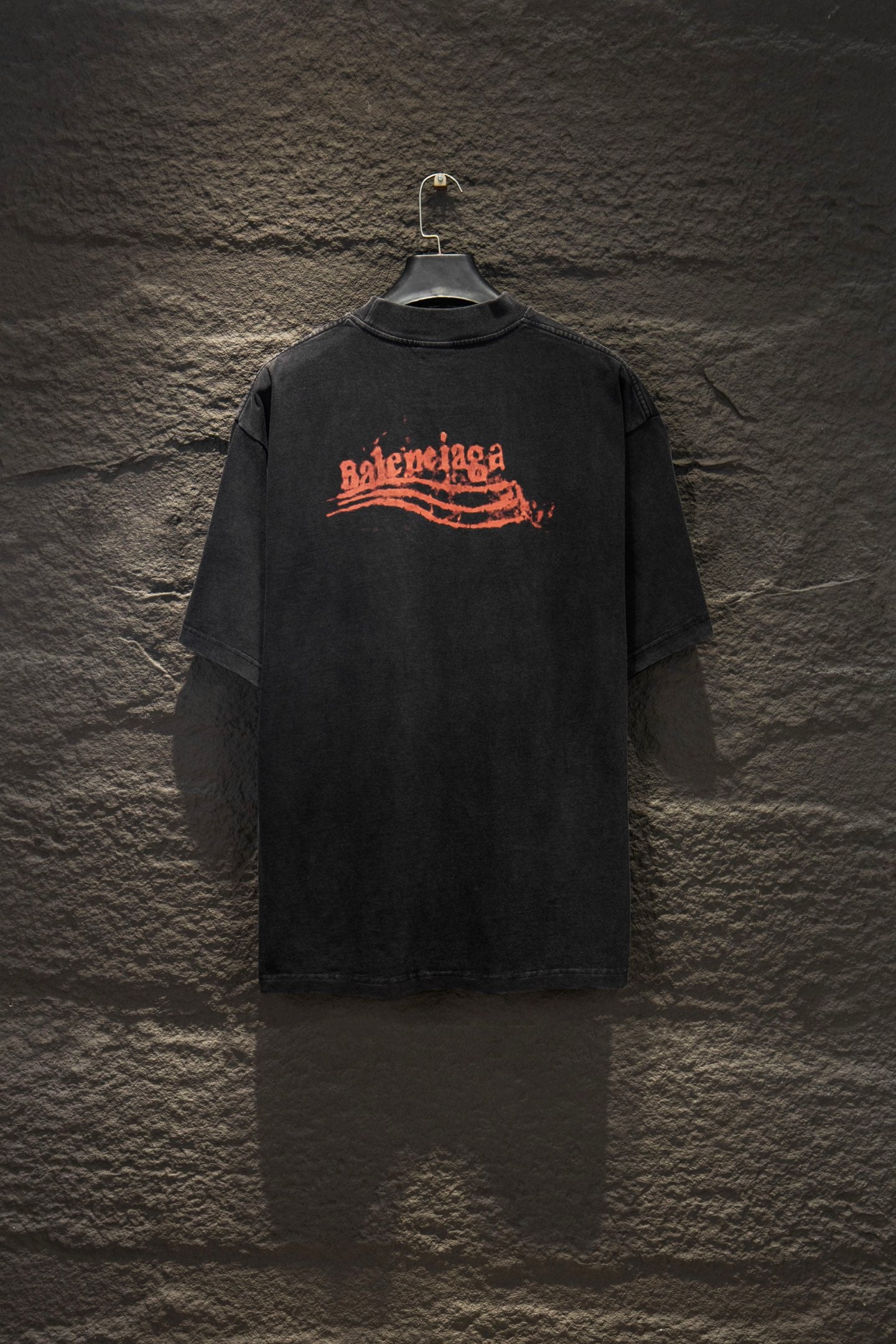 Black Balenciaga short-sleeve T-shirt with orange logo graphic