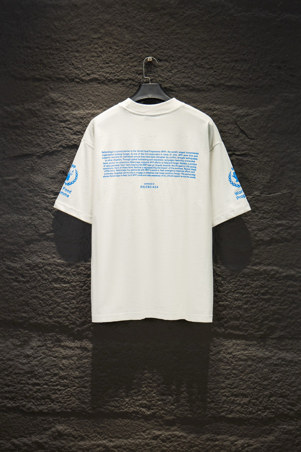 White Balenciaga T-shirt with blue text graphic on back