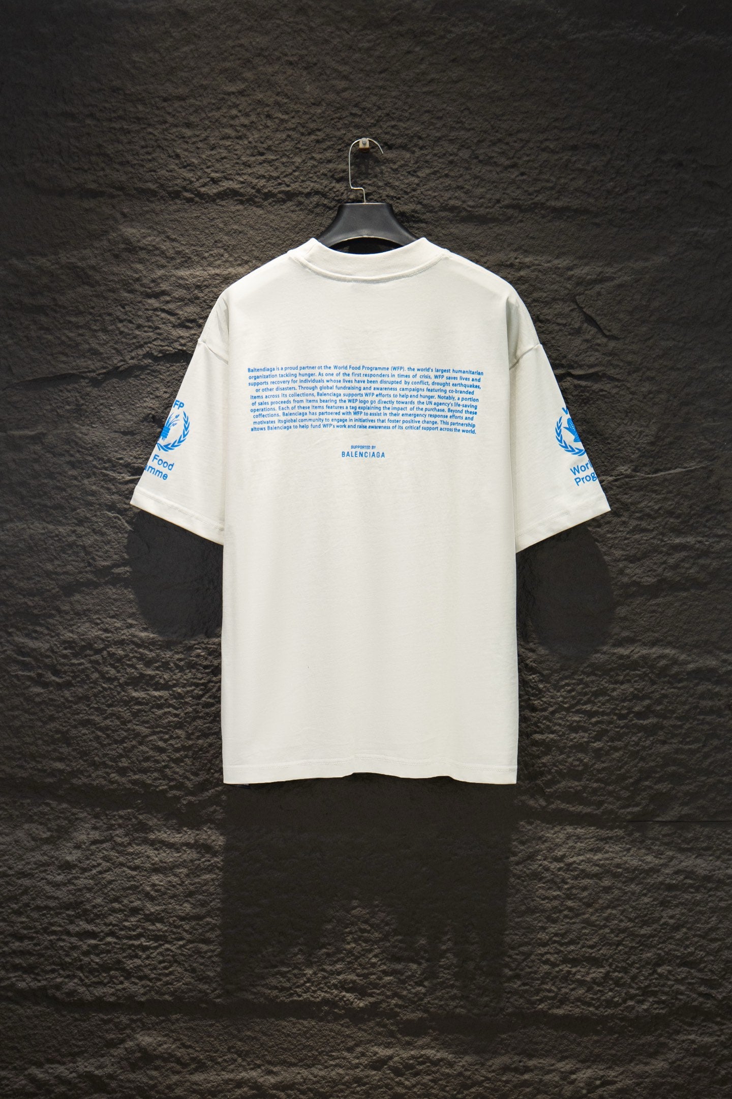 White Balenciaga T-shirt with blue text graphic on back
