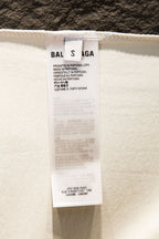 White T-shirt fabric label with BALENCIAGA branding and care details