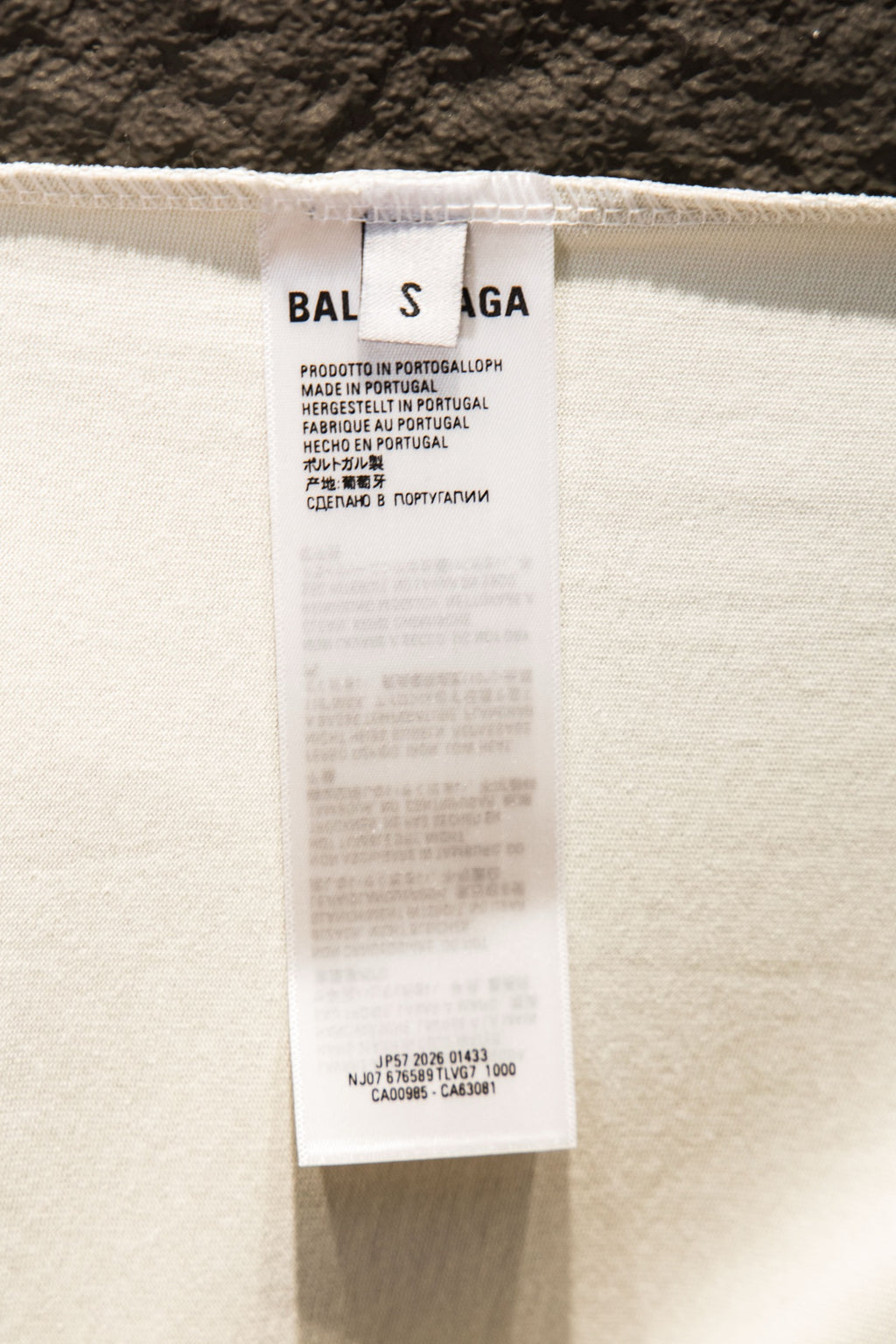 White T-shirt care label on inside tag near collar