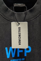 Gray T-shirt neckline with “BALENCIAGA” tag and blue “WFP” logo