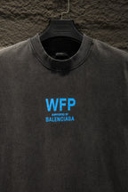 Gray short-sleeve T-shirt with blue “WFP” and “SUPPORTED BY BALENCIAGA”