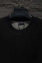 Balenciaga black T-shirt neckline close-up, ribbed crew neck