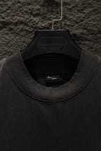 Black crewneck T-shirt neckline with inner label
