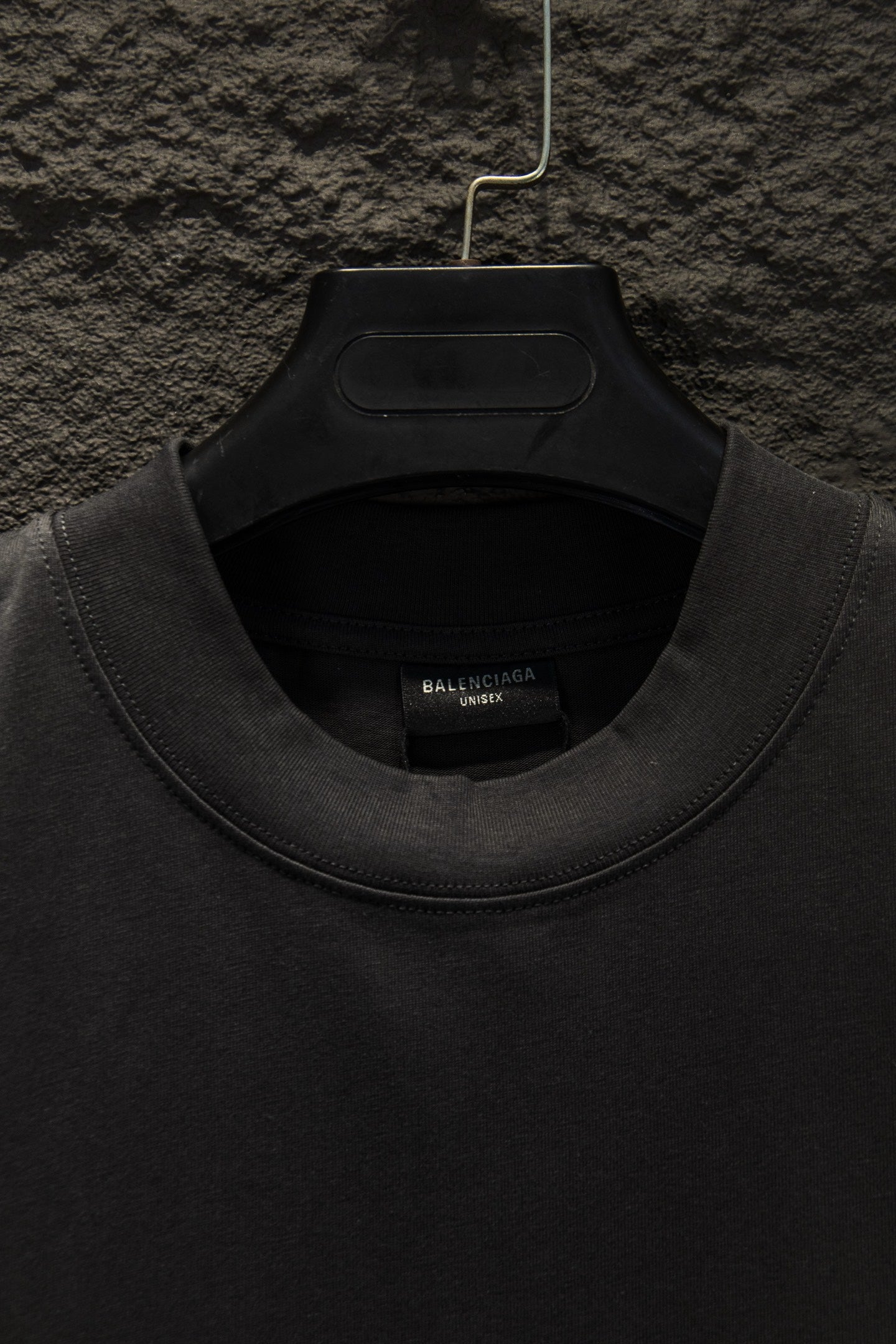 Black crewneck T-shirt neckline with inner label