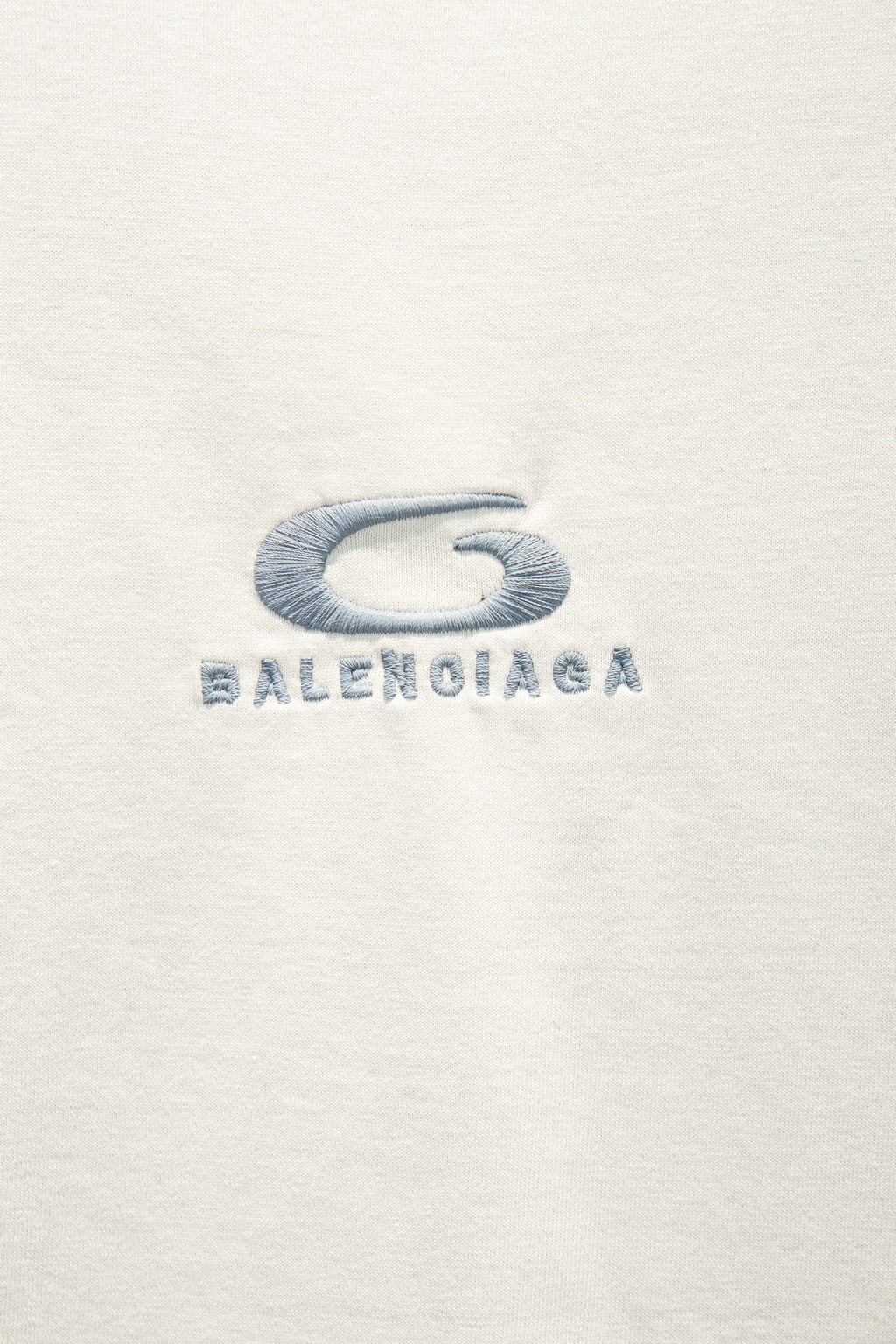 White T-shirt with blue Balenciaga logo graphic on chest