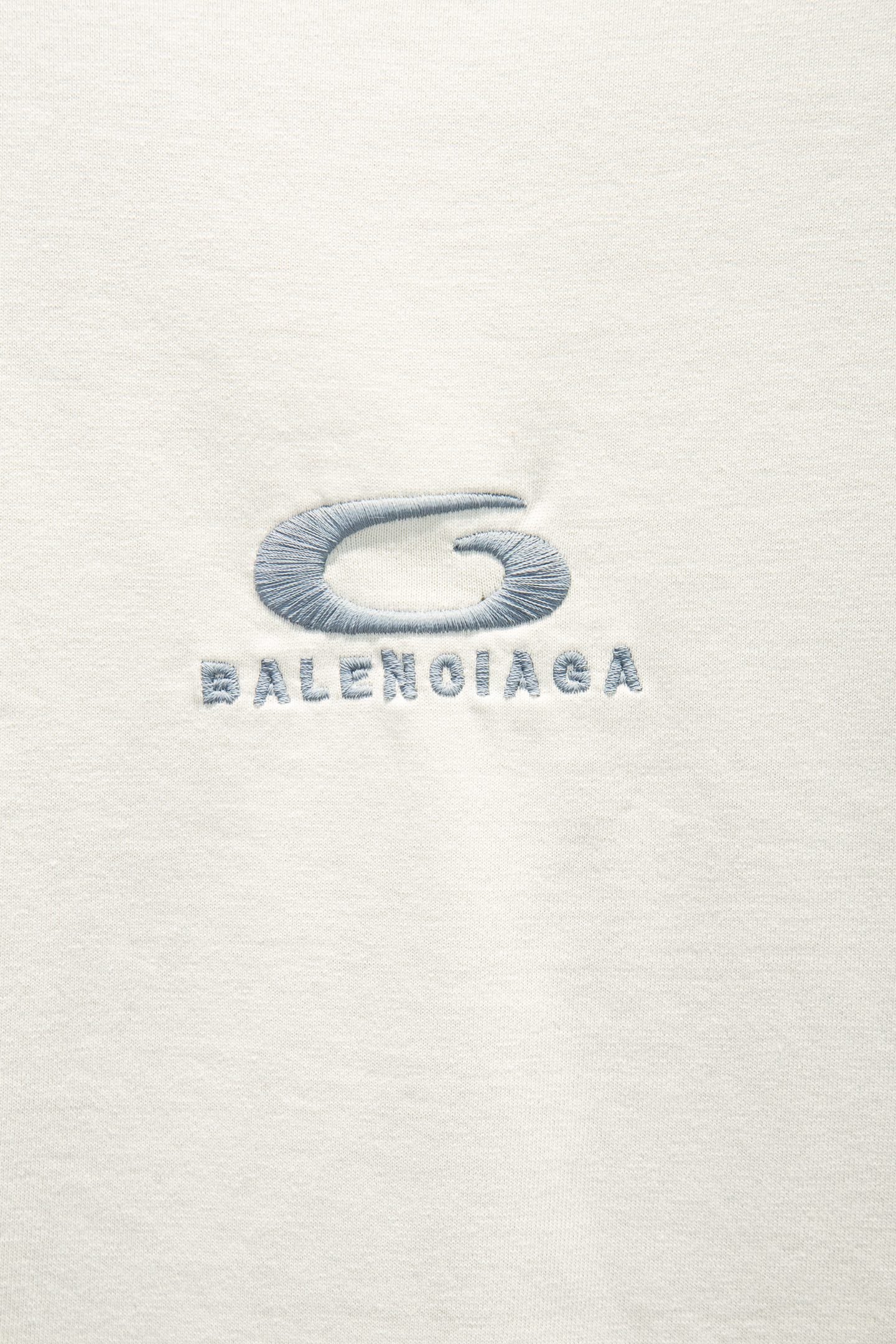 White T-shirt with blue Balenciaga logo graphic on chest