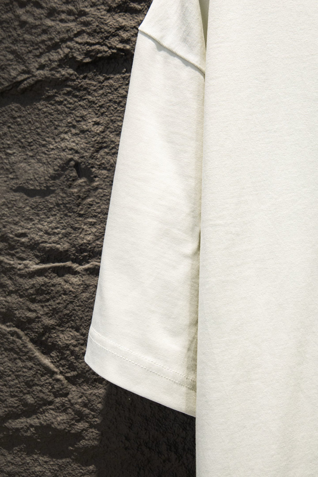 White T-shirt hem with stitched sleeve edge