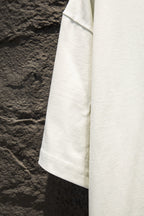 White T-shirt hem with stitched sleeve edge