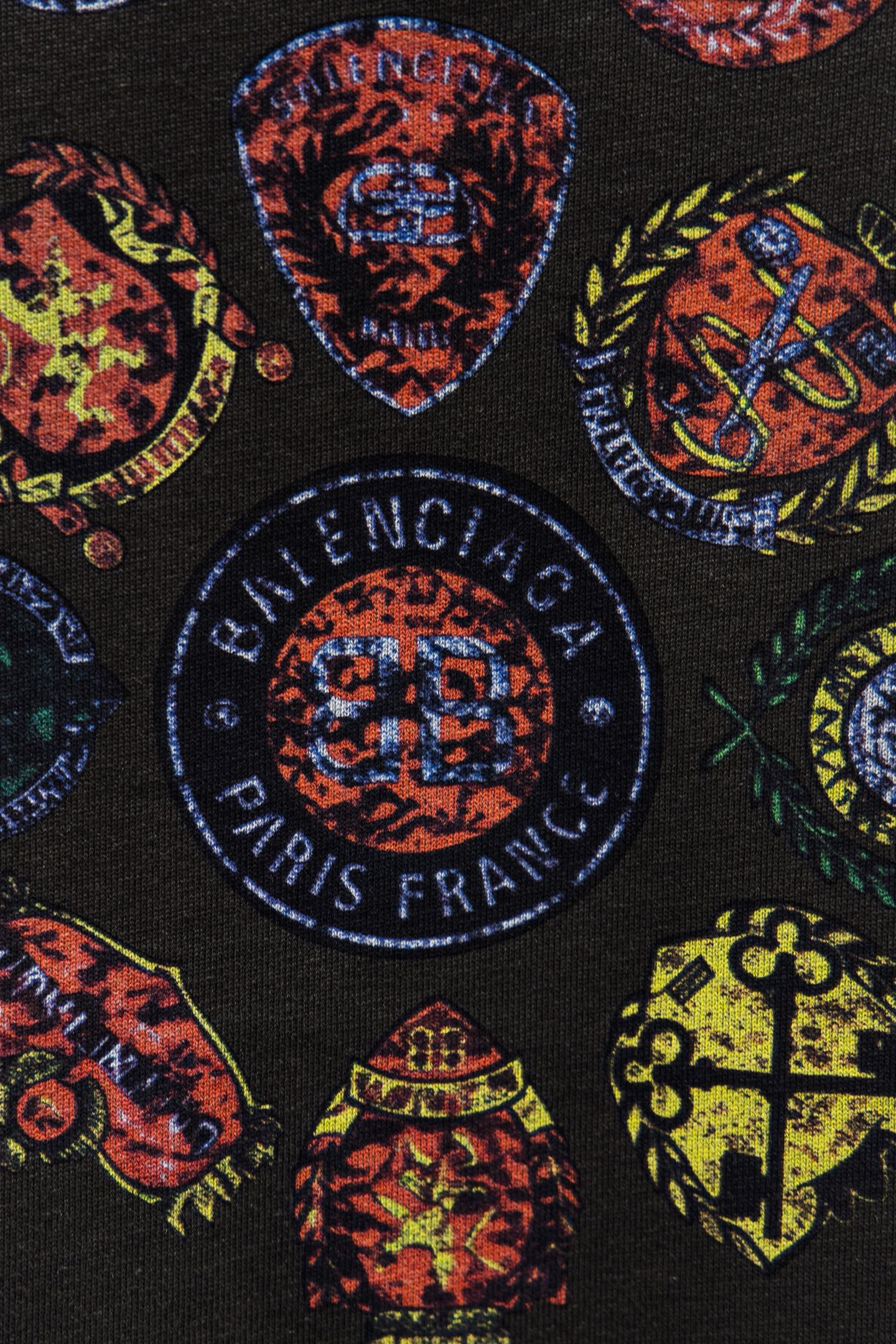 Balenciaga short-sleeve T-shirt fabric close-up with multicolor emblem graphics