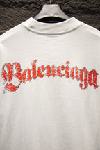 White Balenciaga T-shirt with red Balenciaga wordmark graphic across front