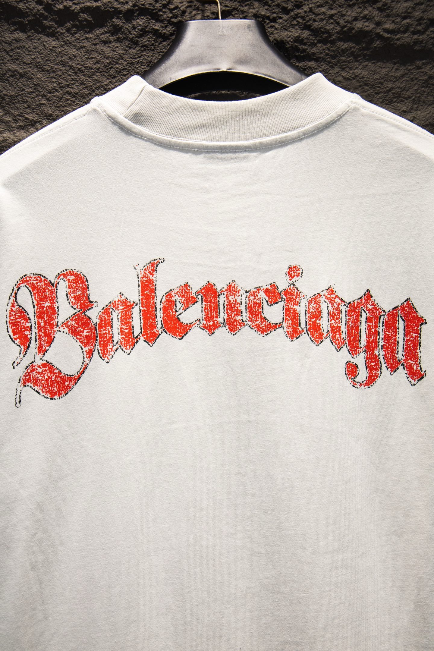 White Balenciaga T-shirt with red Balenciaga wordmark graphic across front