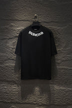 Black short-sleeve T-shirt with BALENCIAGA chest logo.