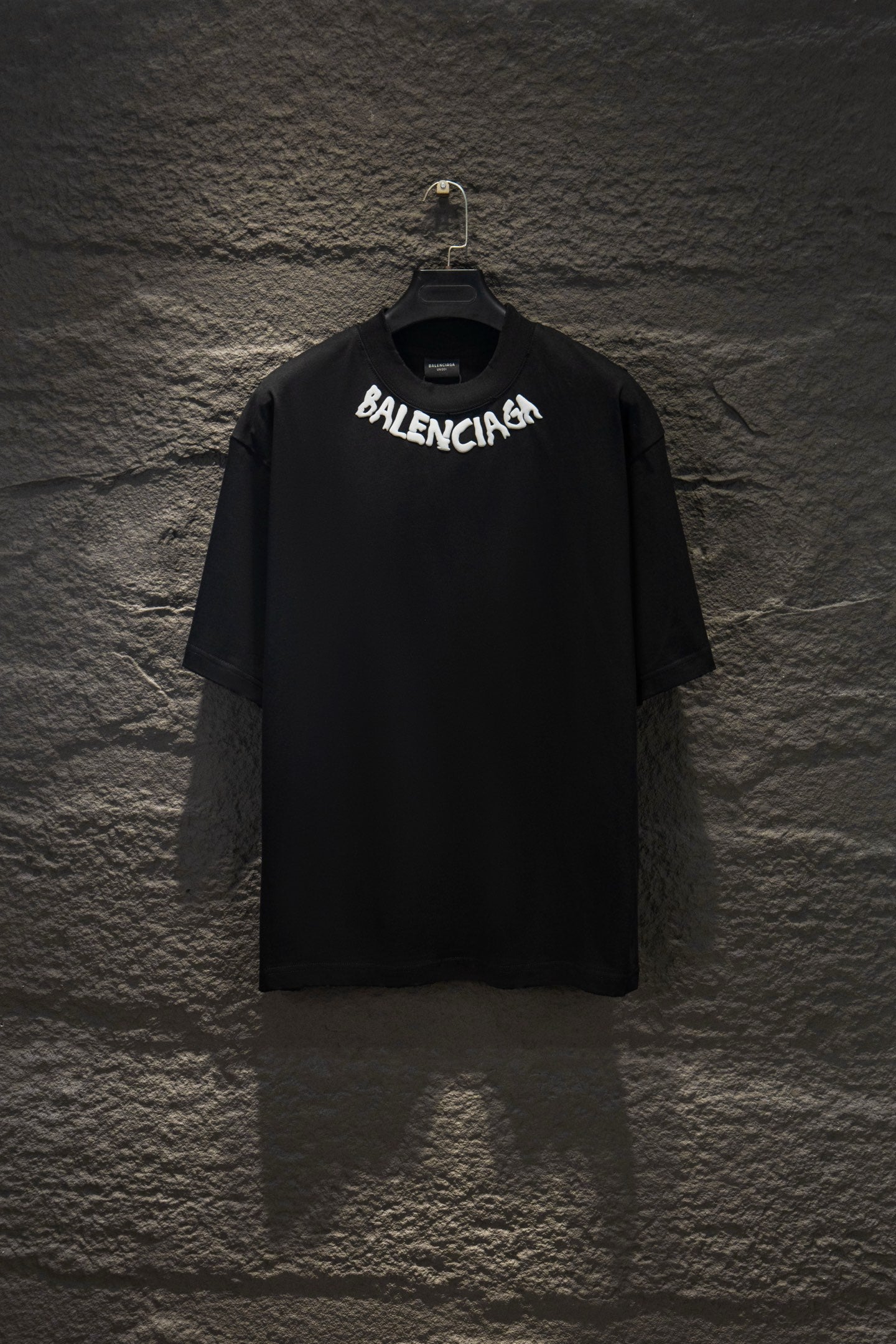 Black short-sleeve T-shirt with BALENCIAGA chest logo.