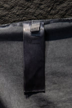 Balenciaga size tag inside collar on light gray T-shirt.