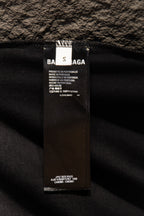Black T-shirt care and size label tag stitched inside the garment
