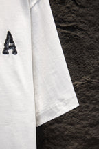 Balenciaga white T-shirt side view with partial graphic letter A