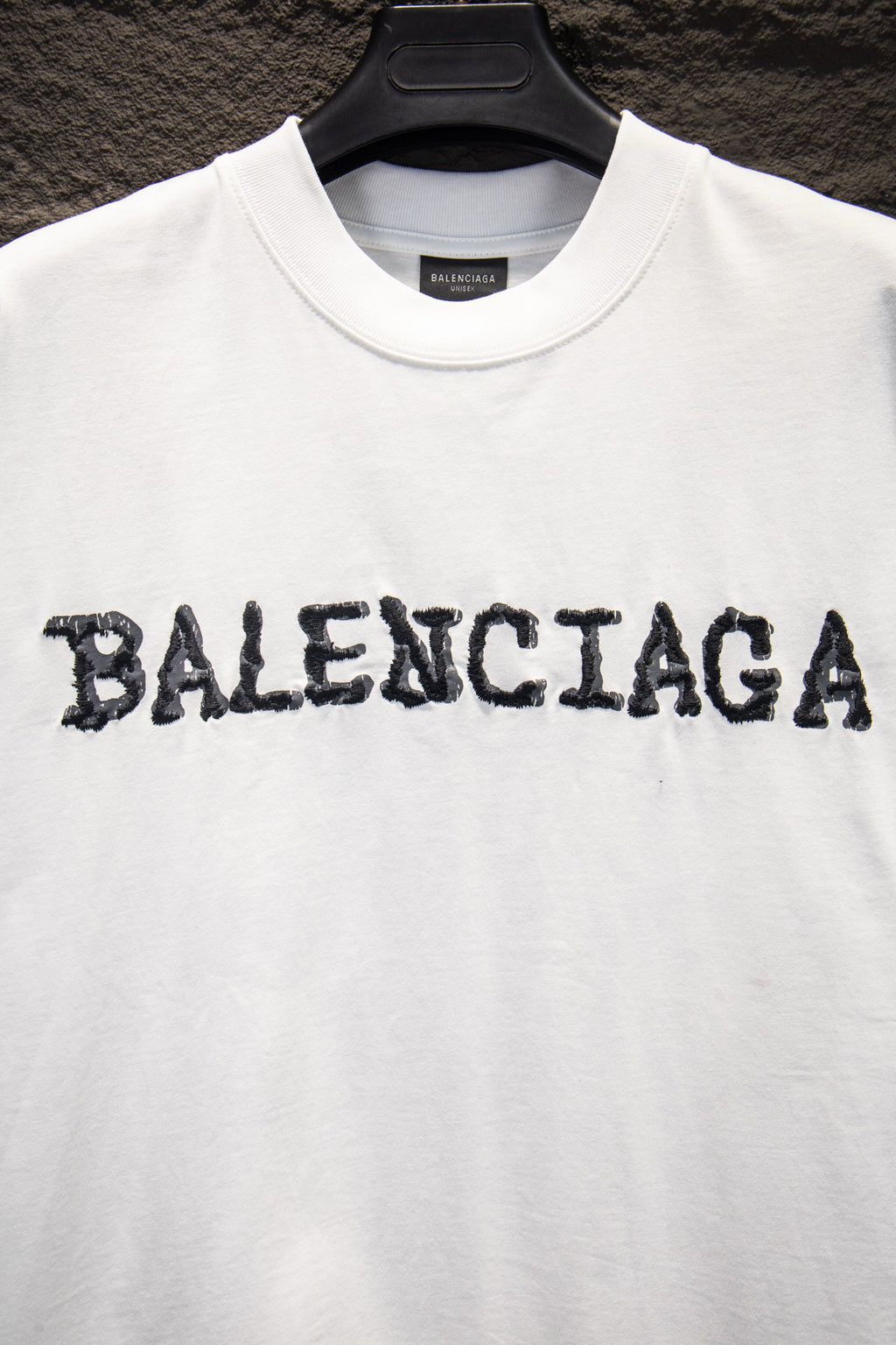 Balenciaga white T-shirt with distressed BALENCIAGA lettering across chest