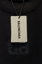 Balenciaga T-shirt with brand hang tag and rhinestone chest graphic