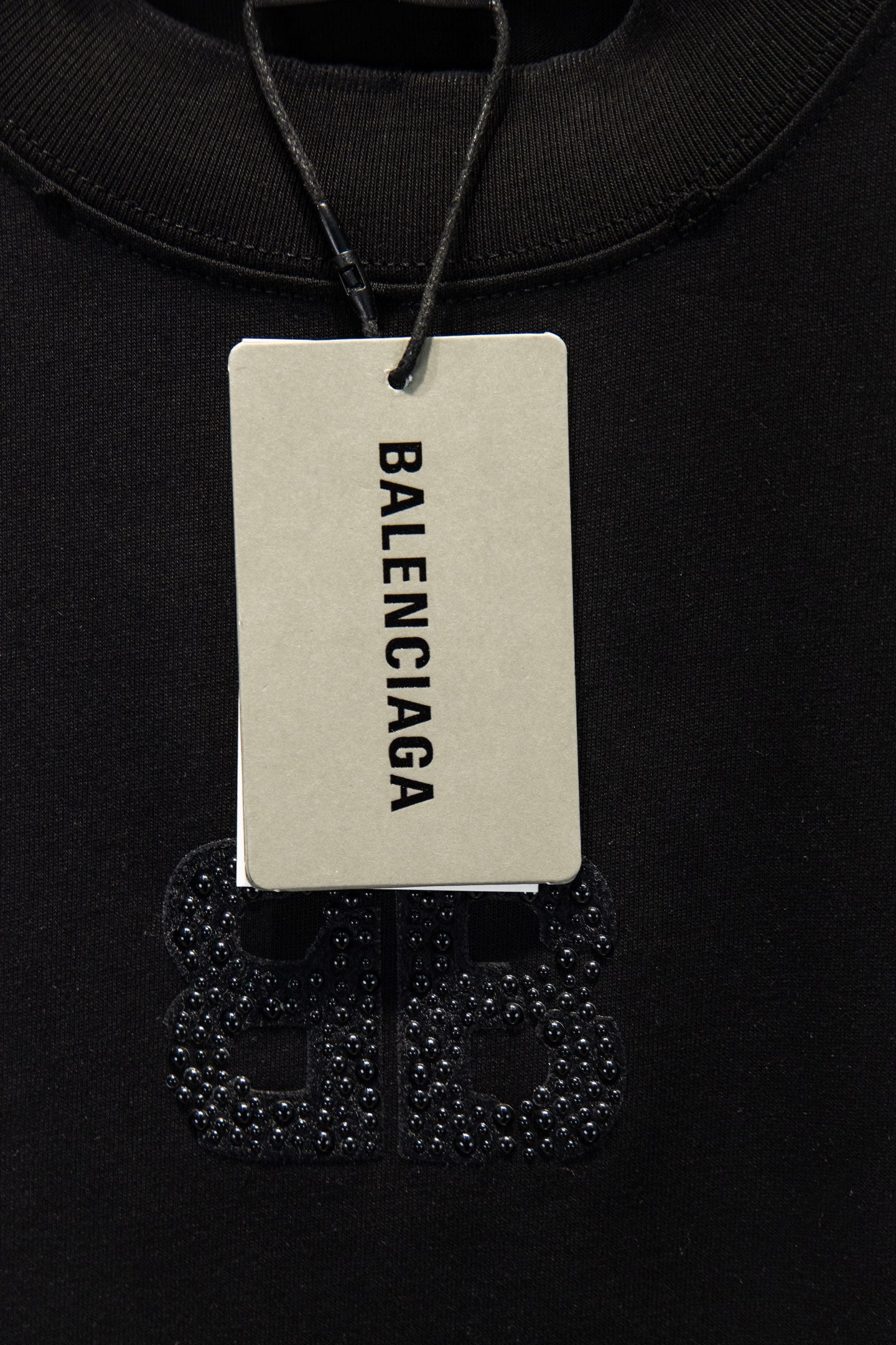 Balenciaga T-shirt with brand hang tag and rhinestone chest graphic