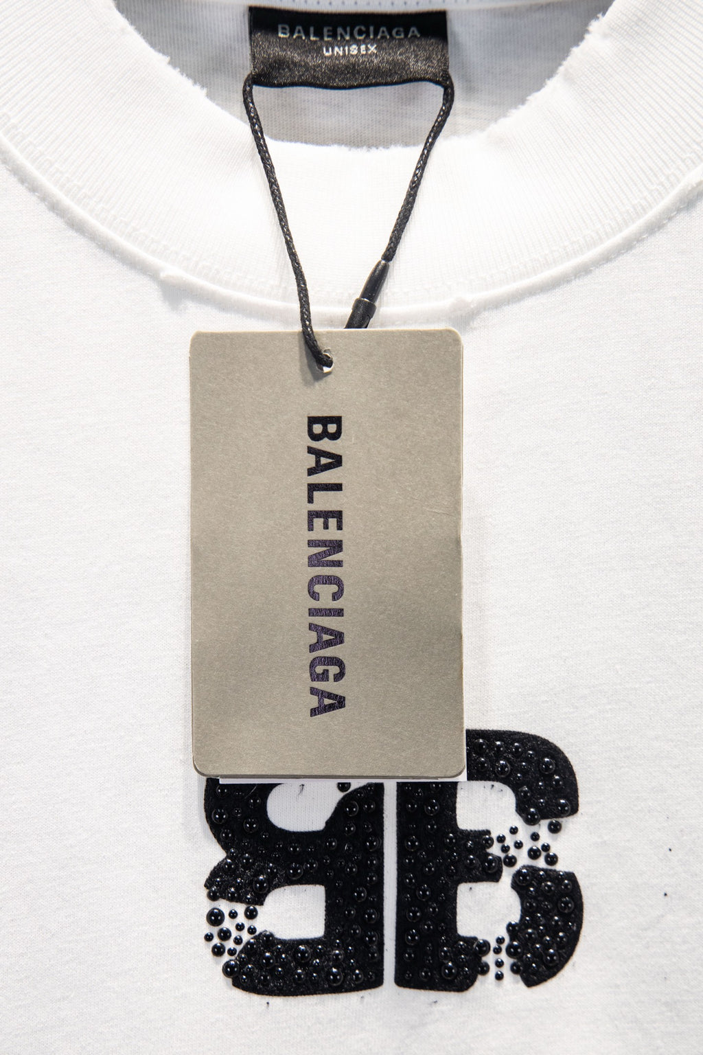 Balenciaga white T-shirt with hanging care tag and front logo