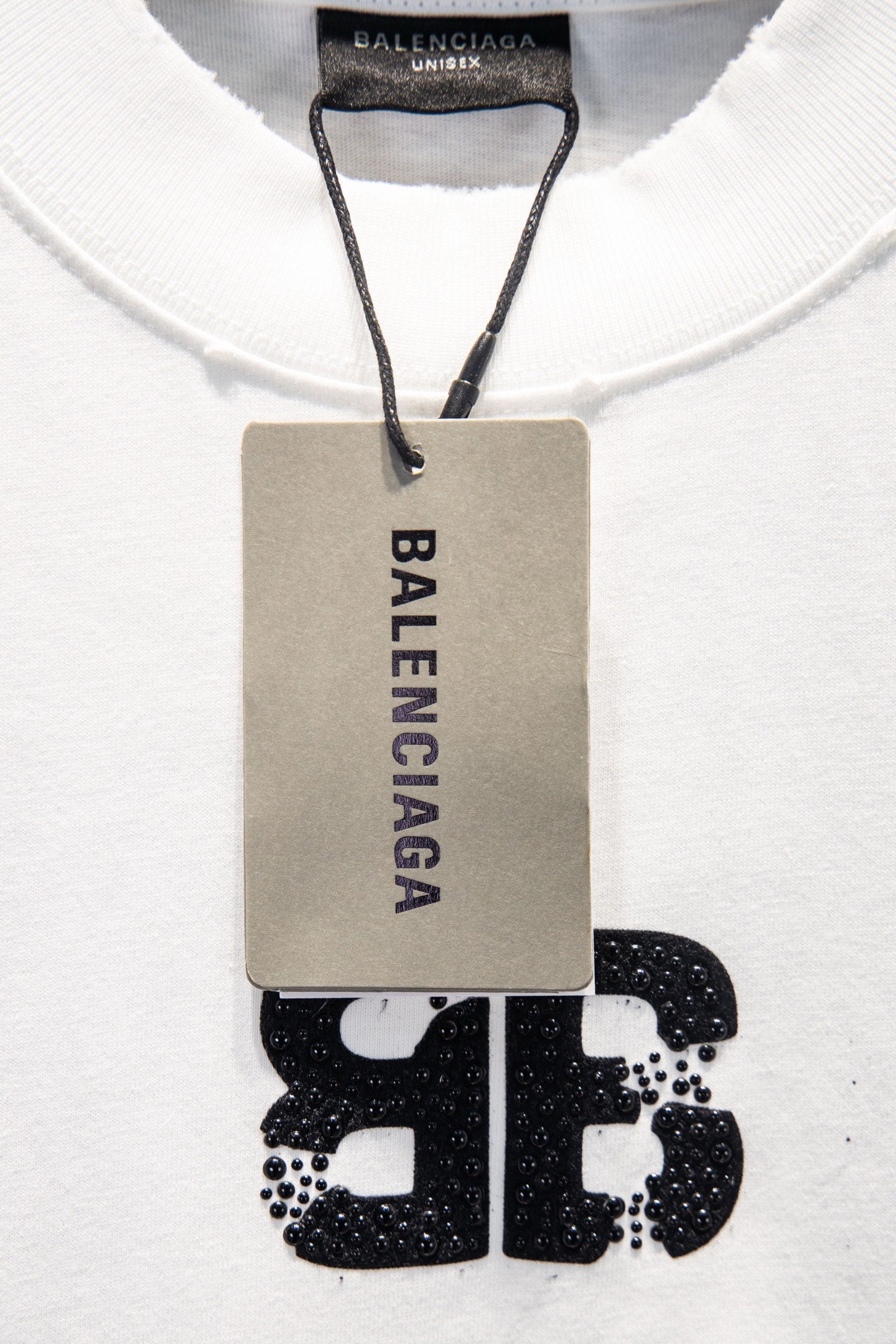 Balenciaga white T-shirt with hanging care tag and front logo