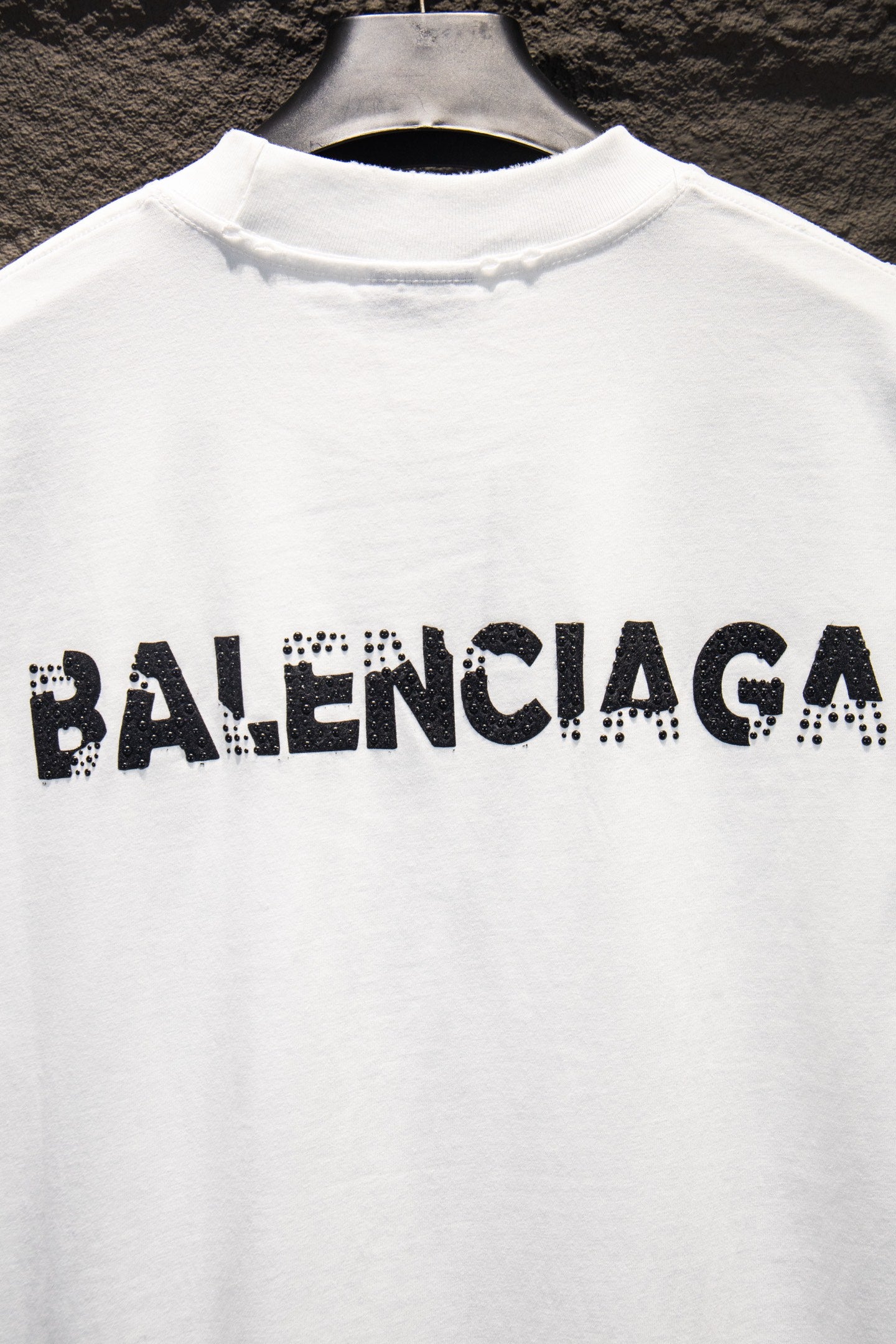 Balenciaga white T-shirt with large BALENCIAGA text logo across chest